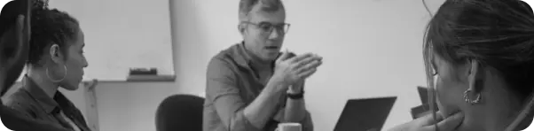 Persons in a meeting and working